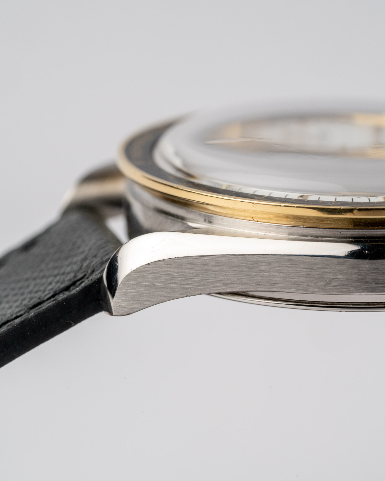 Vintage Omega Speedmaster Reduced two-tone white dial 175.0032 from 1990s watch lug chamfer