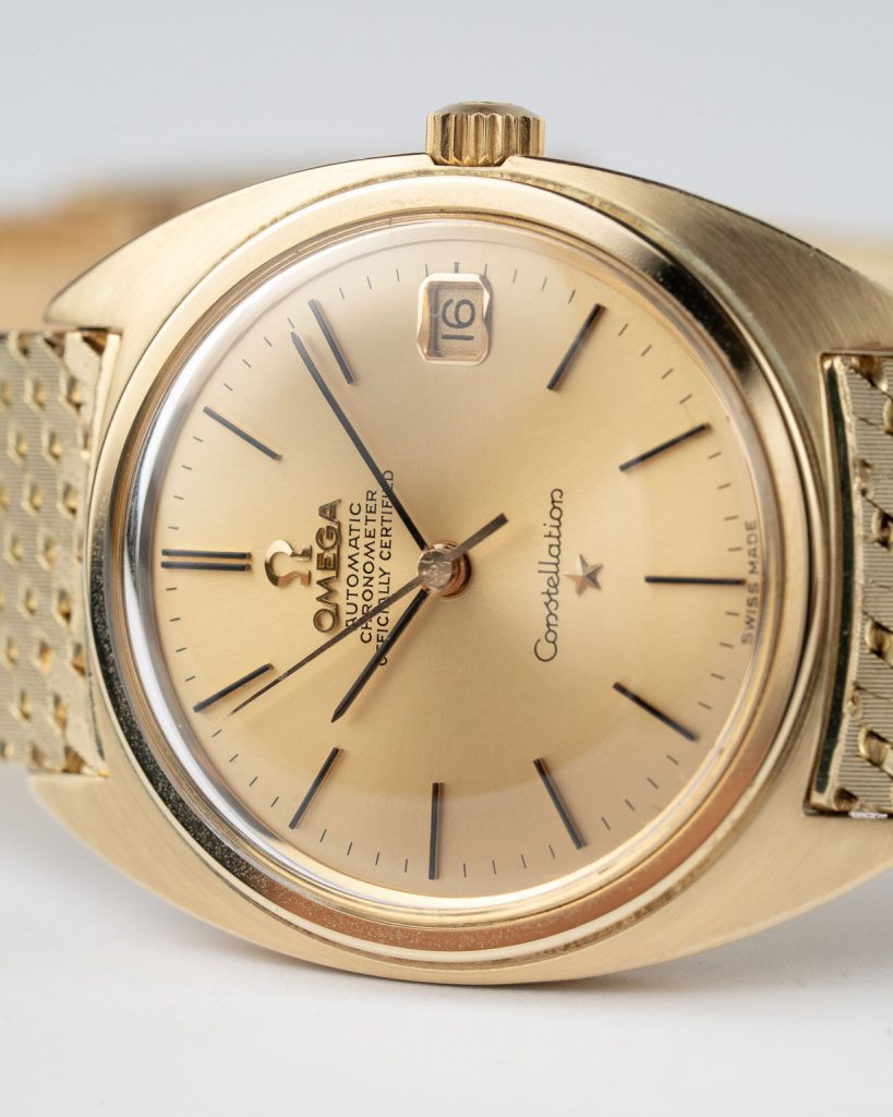 Vintage Omega Constellation C-shape date 14k Yellow Gold with Yellow Gold Bracelet 168.009 from 1966 laying