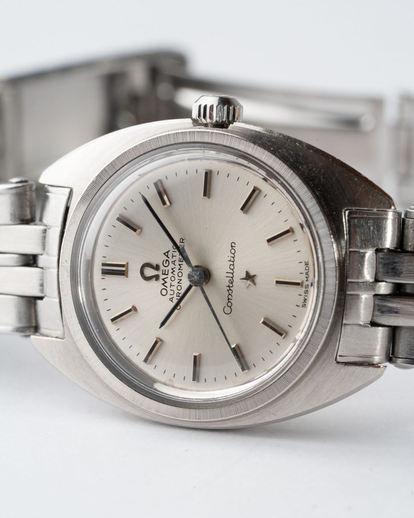 Vintage Omega Constellation C-shape Ladies 18k White Gold with Silver Sunburst dial 567.001 from 1968 laying