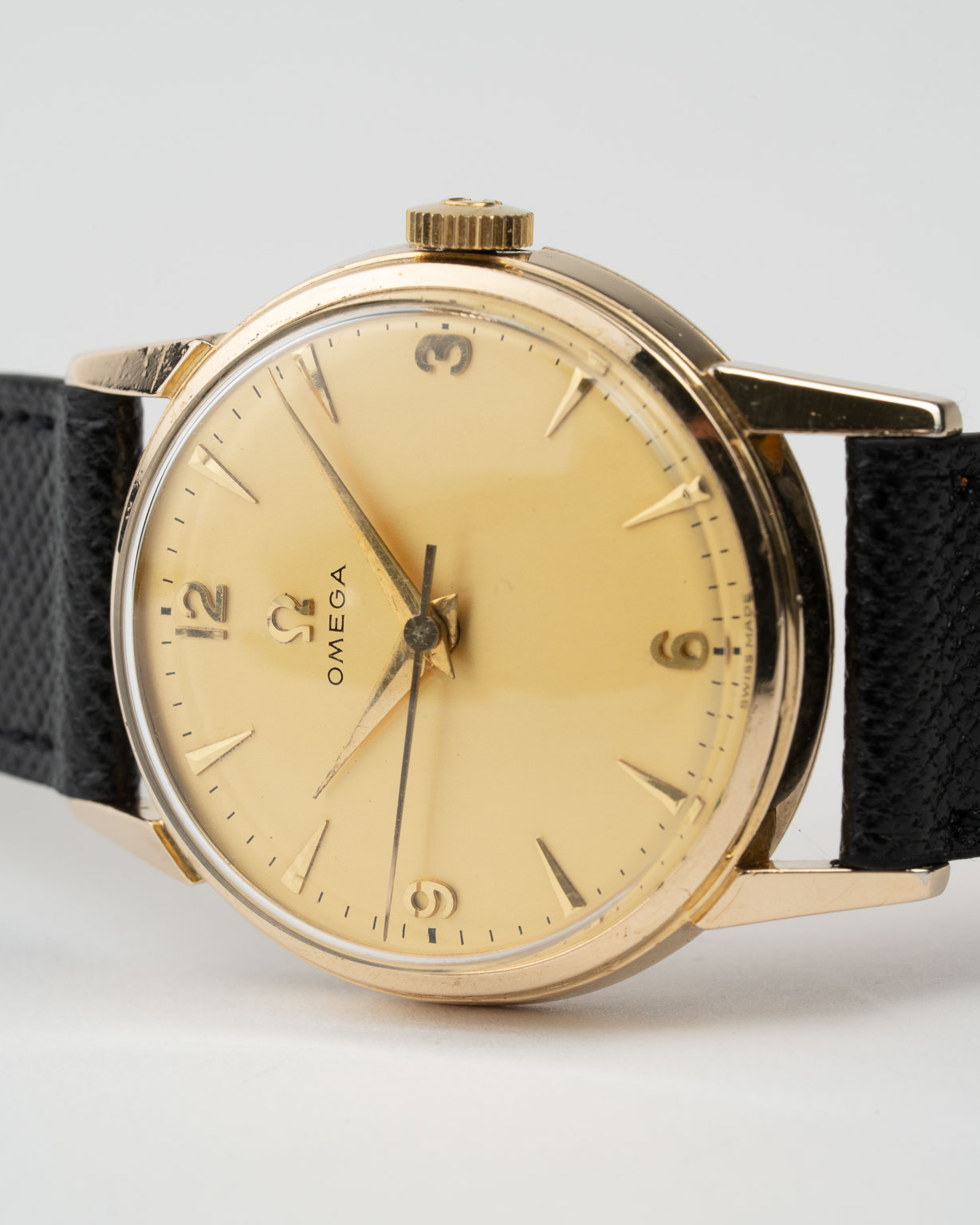 Vintage Omega Gold plated dresswatch with champagne dial and Arabic numerals reference 2902-1 from 1957 laying