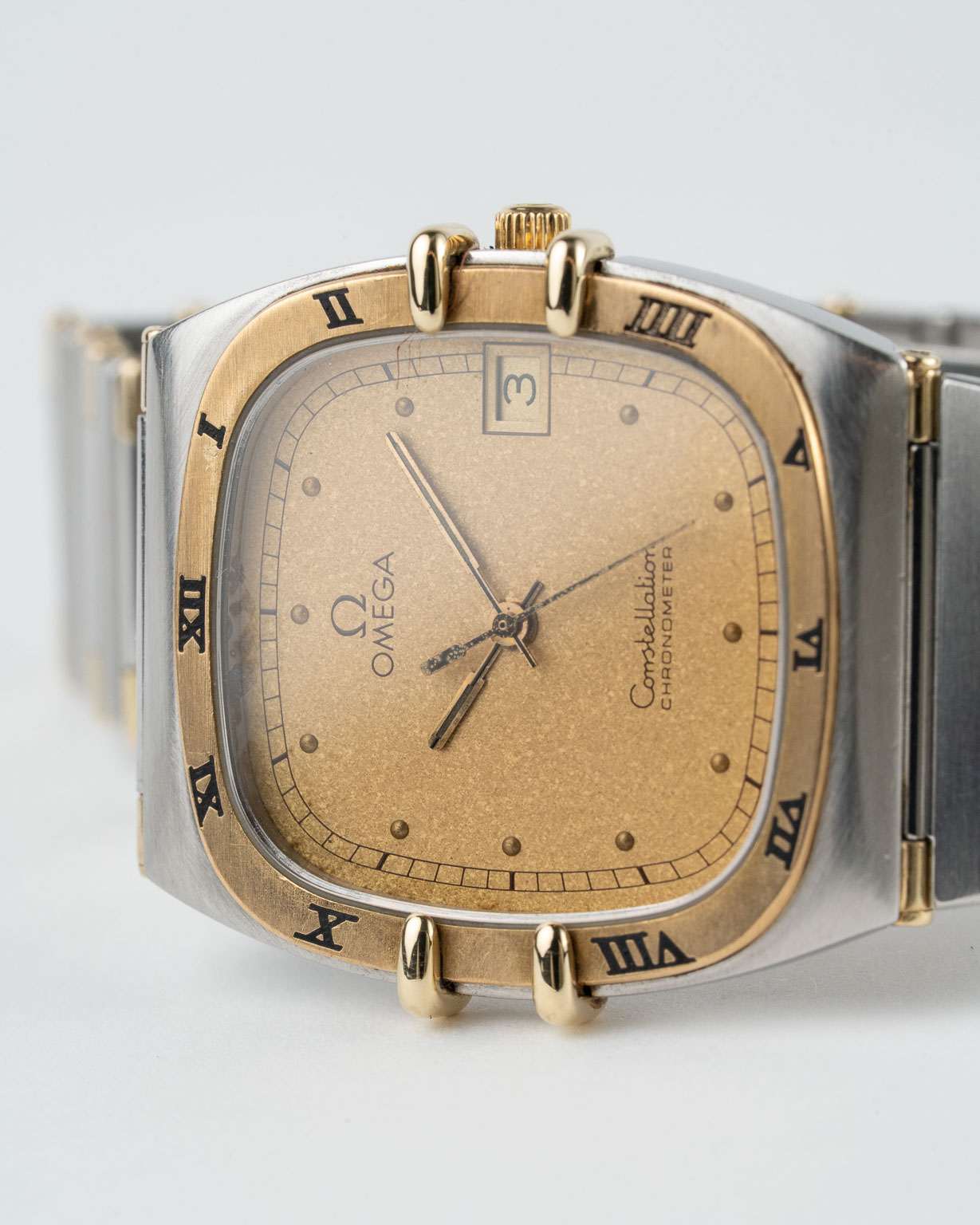 Vintage Omega Constellation quartz with sparkle champagne dial in a two-tone case with integrated bracelet reference 398.0867 from 1982 watch dial