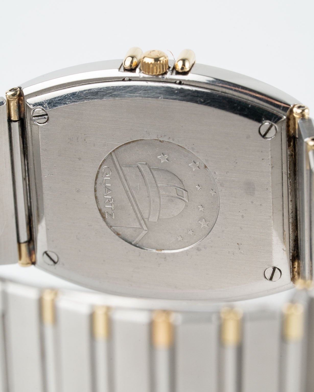 Vintage Omega Constellation quartz with sparkle champagne dial in a two-tone case with integrated bracelet reference 398.0867 from 1982 watch caseback