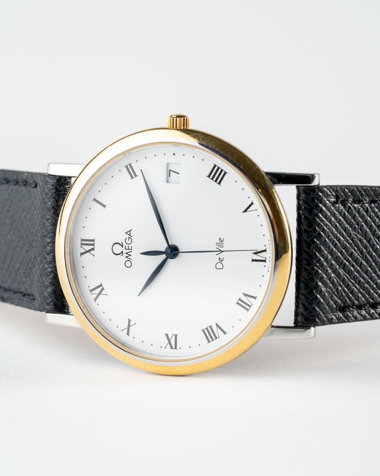 Vintage Omega De Ville quartz with white roman numeral dial in a two-tone case reference 198.2378 from the 1990s watch dial