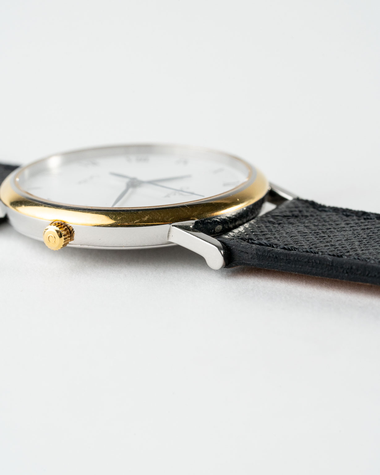 Vintage Omega De Ville quartz with white roman numeral dial in a two-tone case reference 198.2378 from the 1990s watch crown and lug