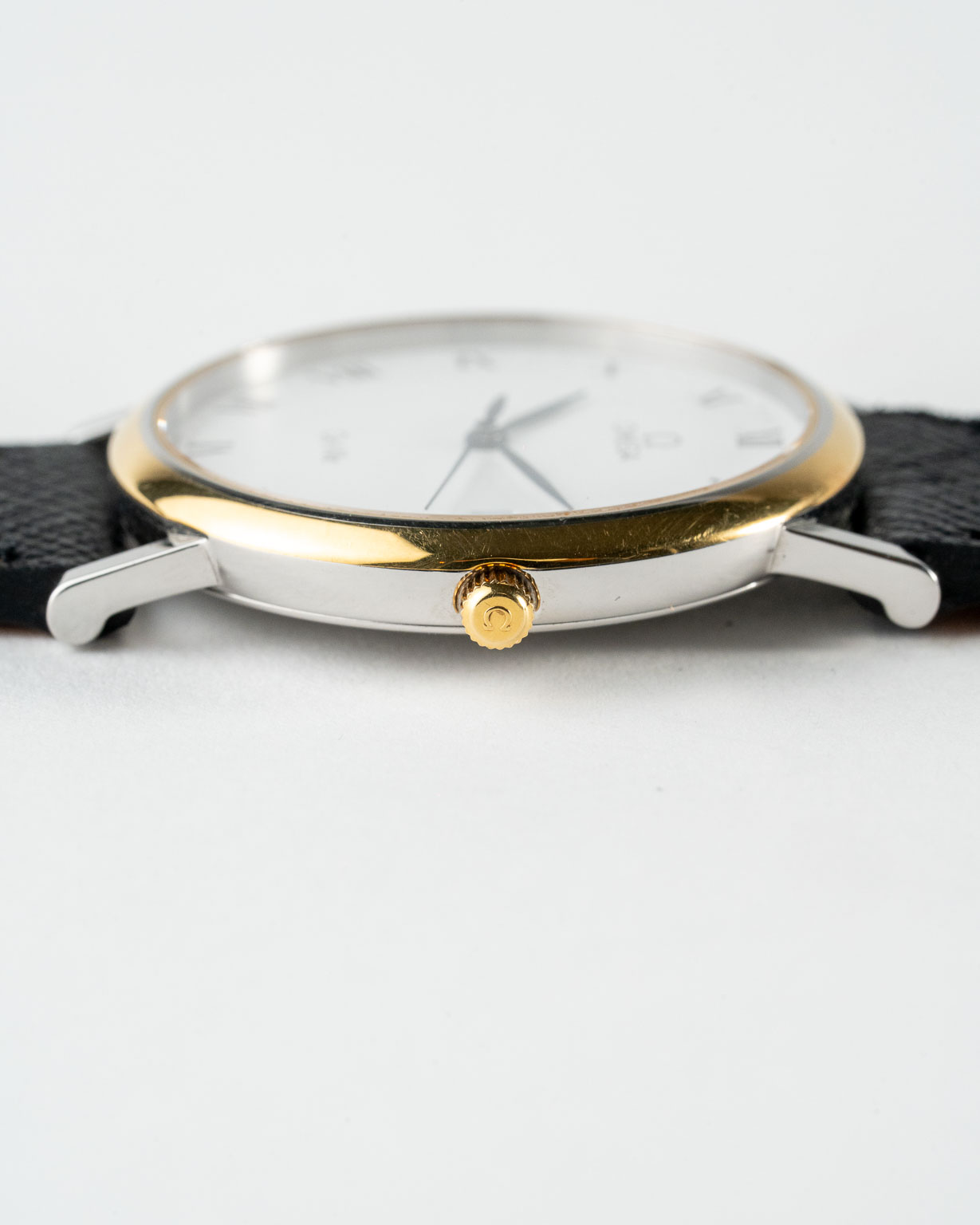 Vintage Omega De Ville quartz with white roman numeral dial in a two-tone case reference 198.2378 from the 1990s watch crown