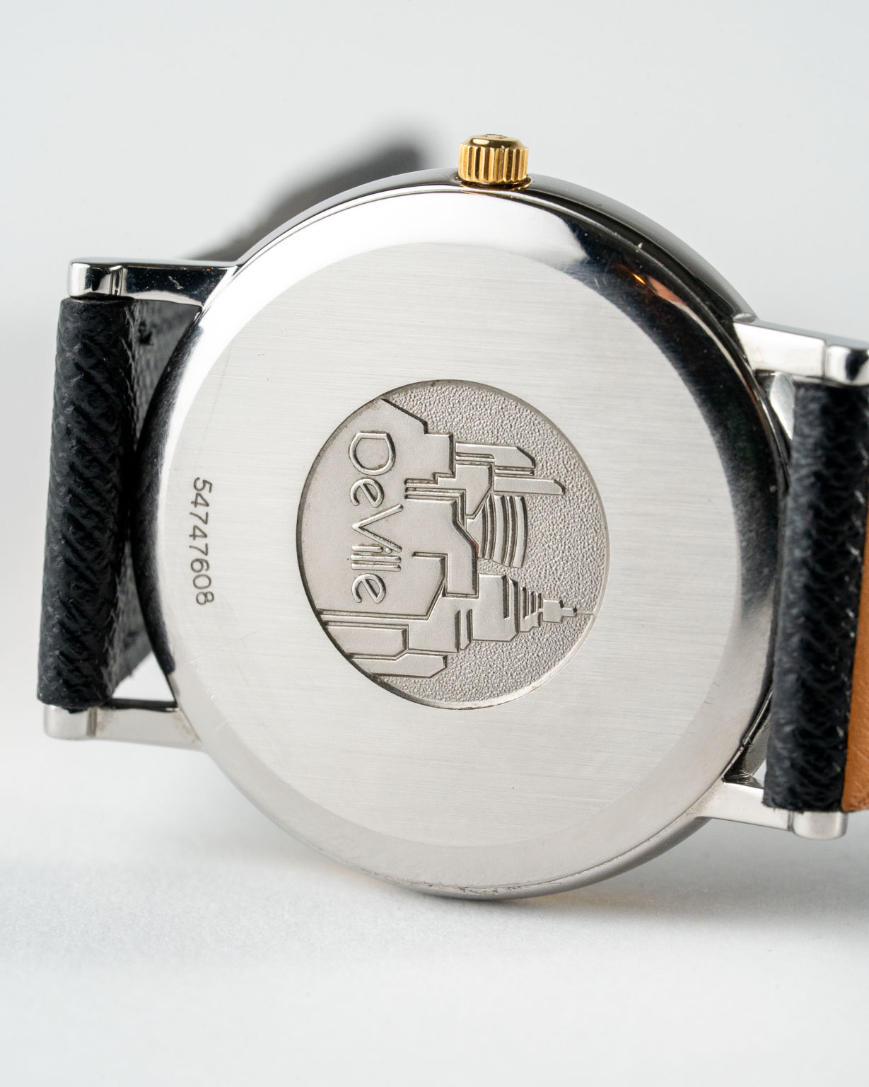 Vintage Omega De Ville quartz with white roman numeral dial in a two-tone case reference 198.2378 from the 1990s watch caseback