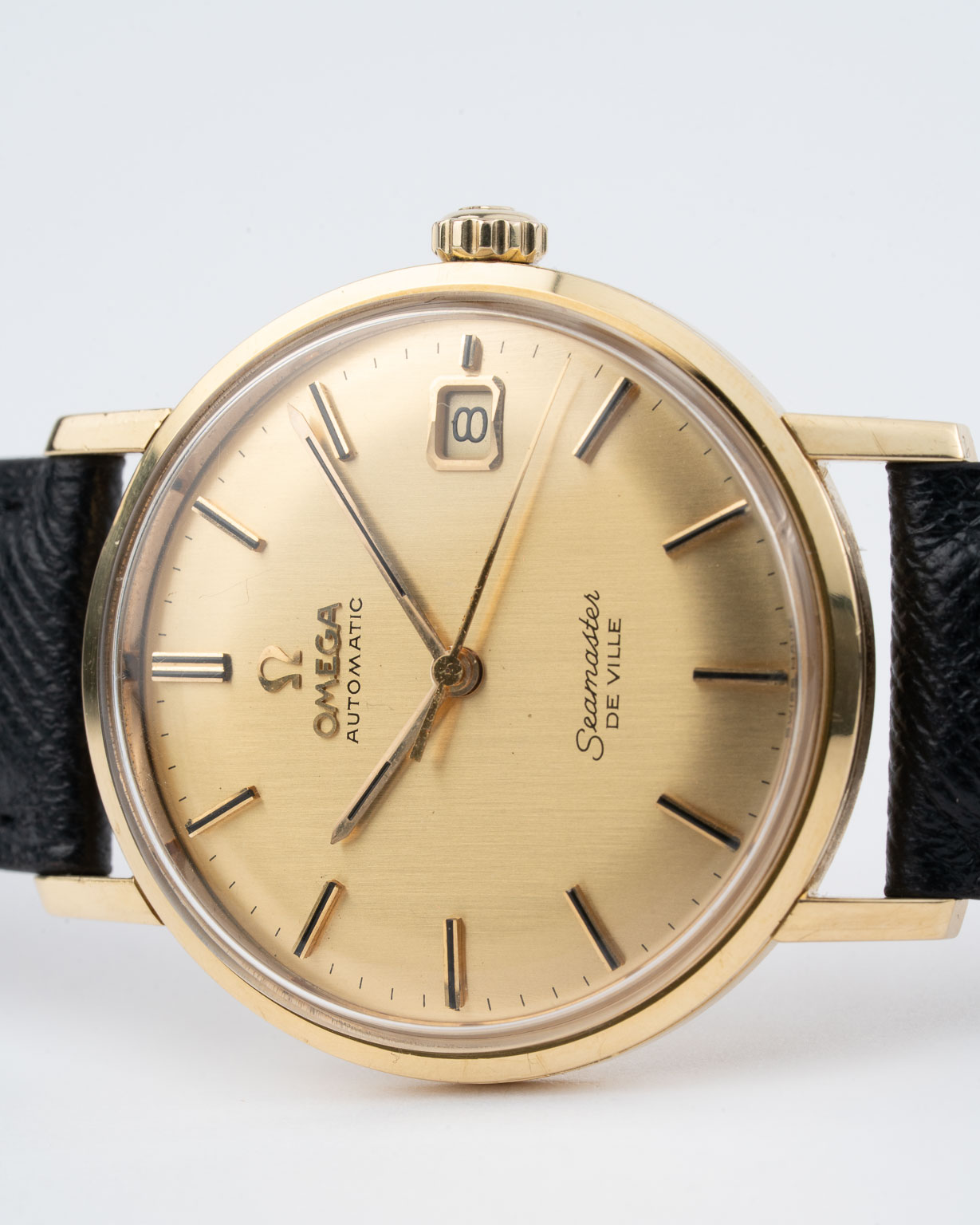 Vintage Omega Seamaster De Ville with gold dial and gold case reference 166.020 from 1965 laying
