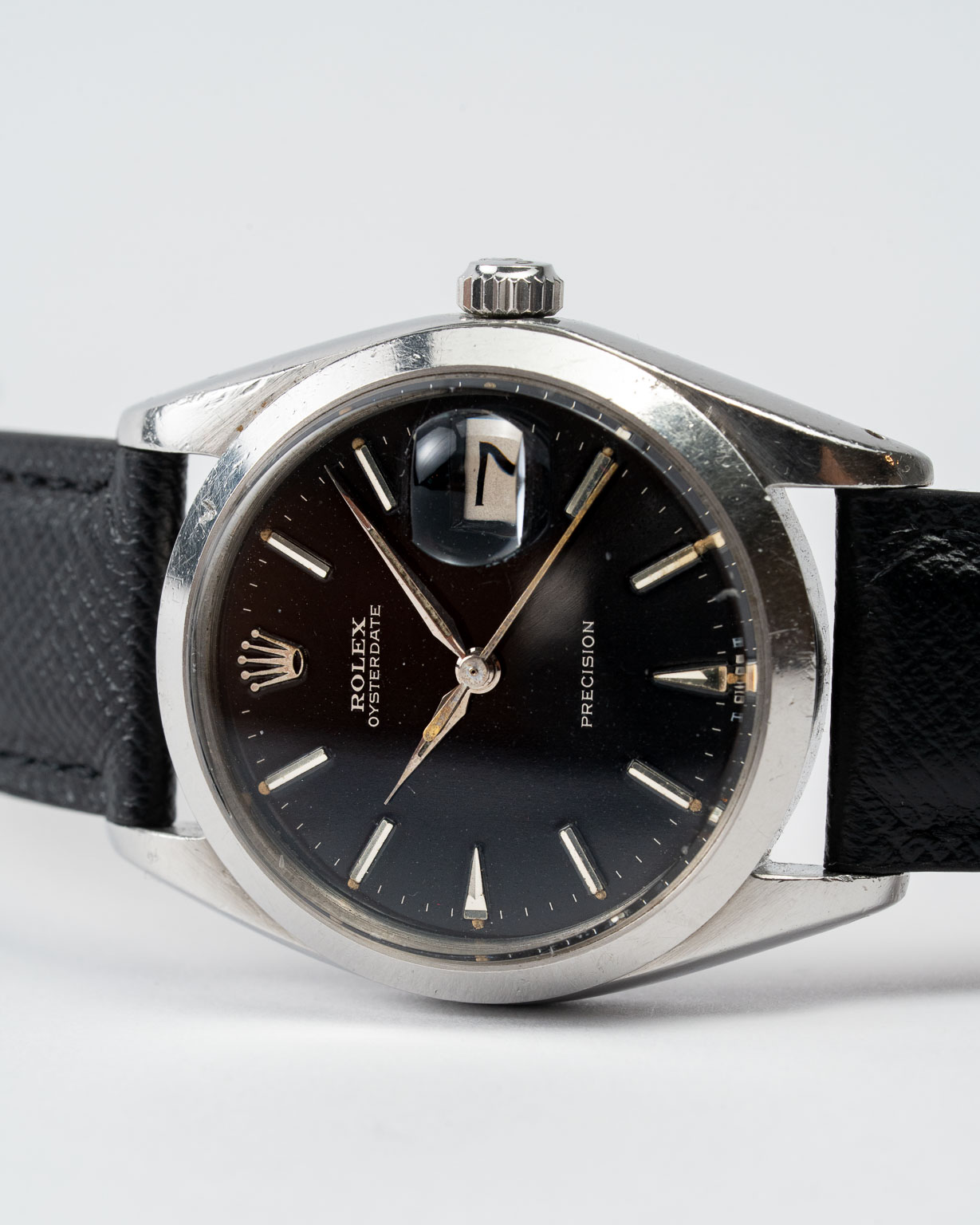 Vintage Rolex Oysterdate Precision 6694 stainless steel Black Gilt (tropical) dial on leather strap from 1953 laying