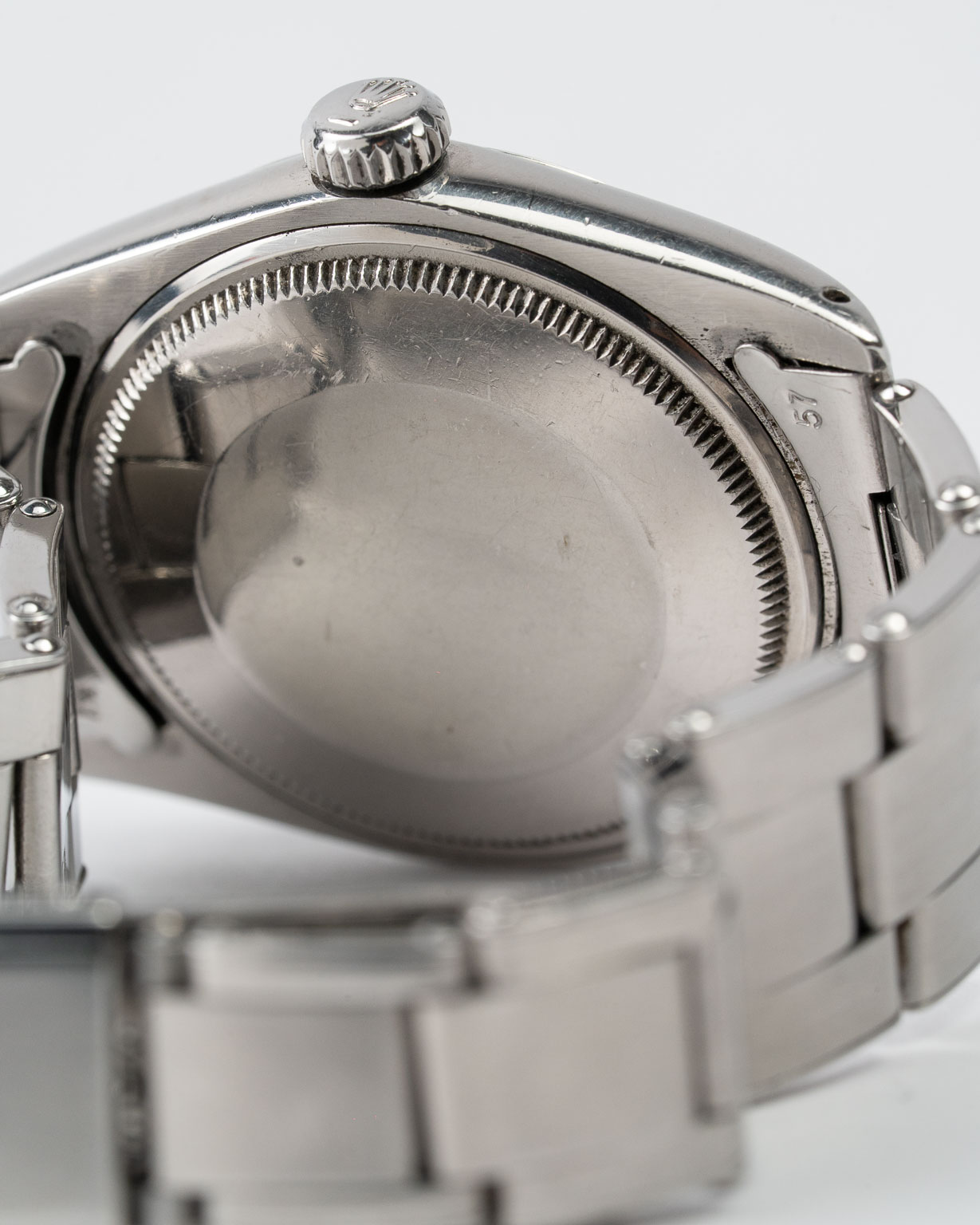 Vintage Rolex Oyster Perpetual Date 1500 stainless steel Black Gilt (tropical) dial on riveted oyster from 1964 bracelet